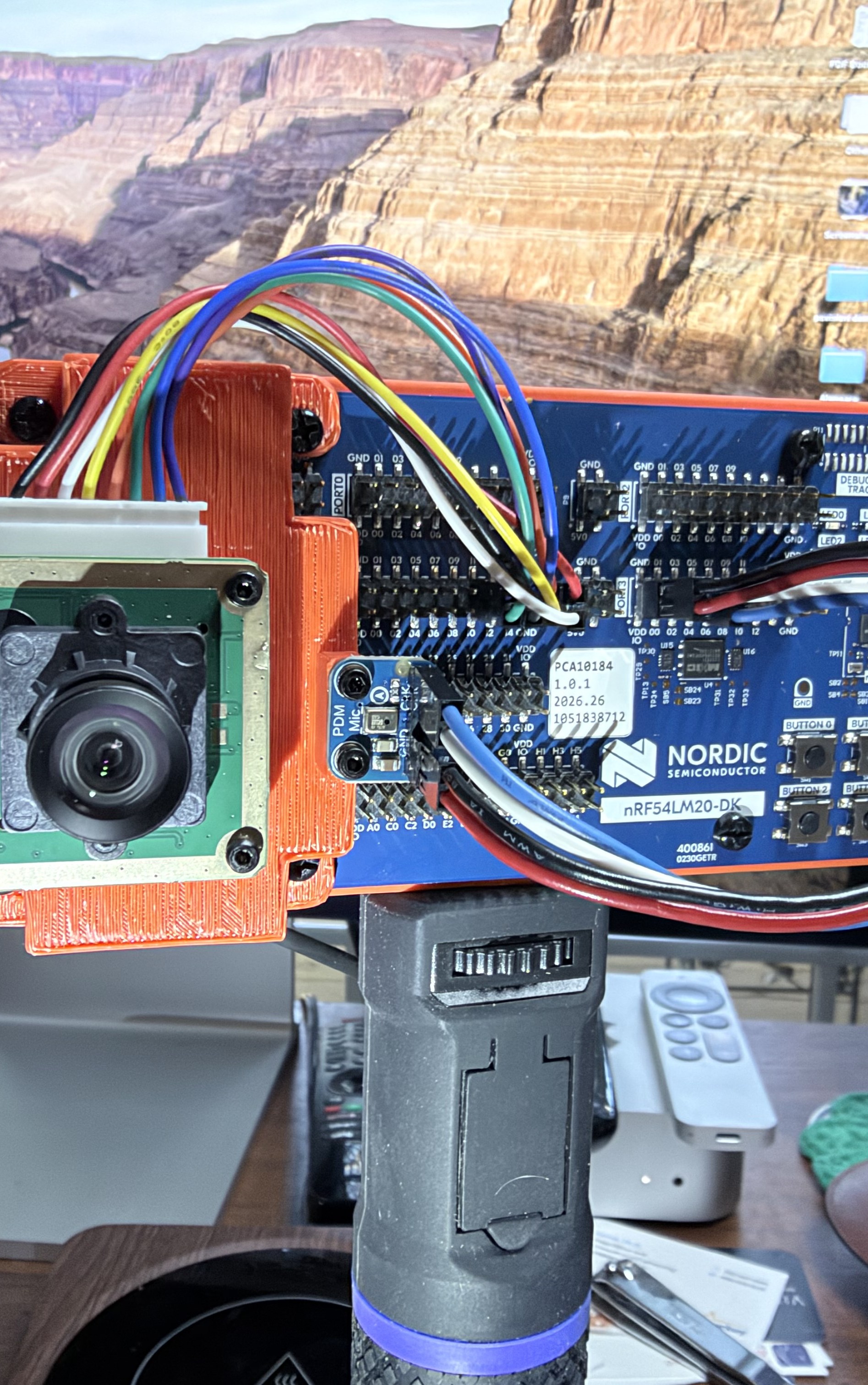 The psvision demo rig: an Arducam B0642 camera on a Nordic nRF54LM20 development kit.